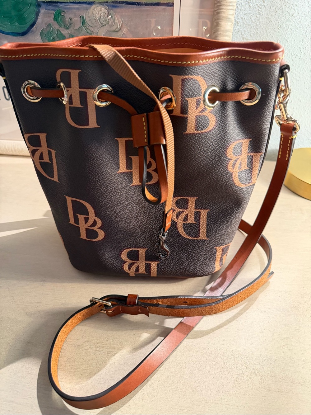 Dooney & Bourke Chocolate Brown and Tan Monogram Drawstring Crossbody